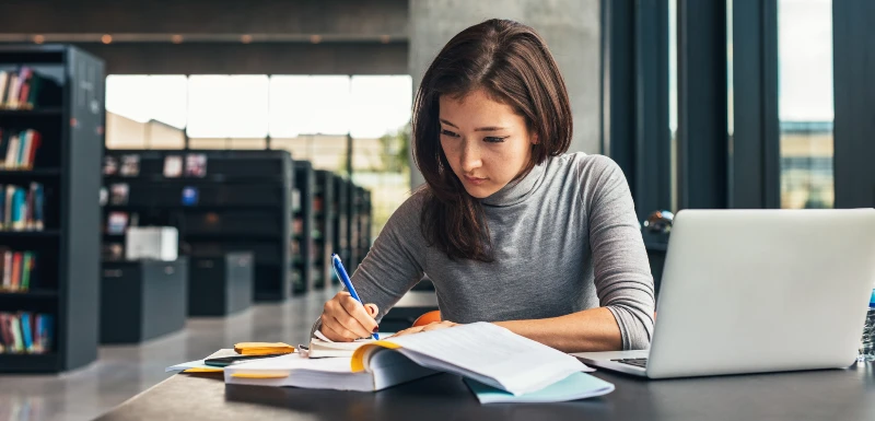Student studying for scholarship opportunities